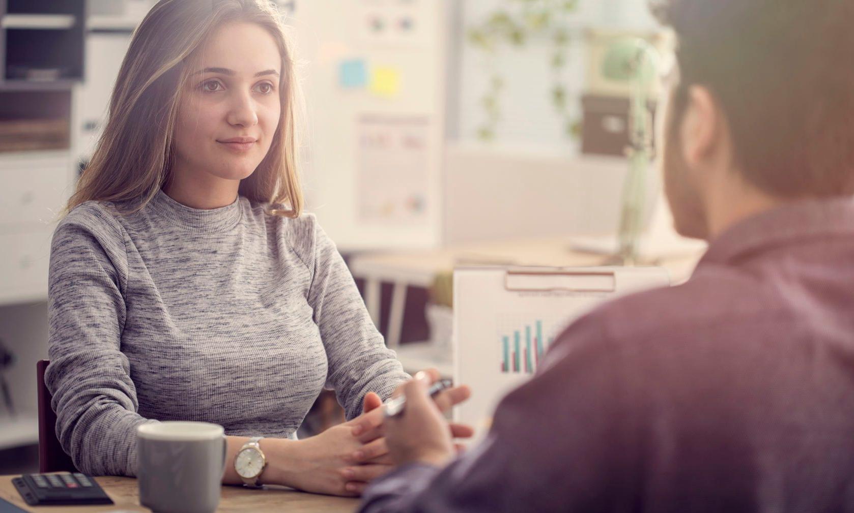 young man talking with a young woman